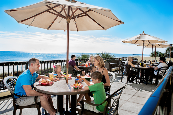 Family Eating on an Oceanfront Patio