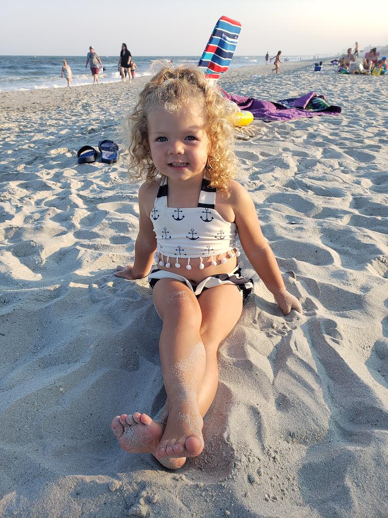 Little Girl Sitting in the Sand