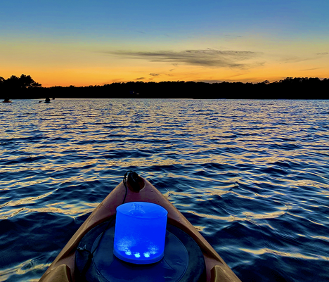 Kayak in the ocean at sunset