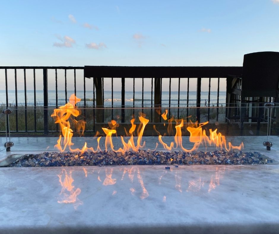 Up close to oceanfront fire pit at Compass Cove