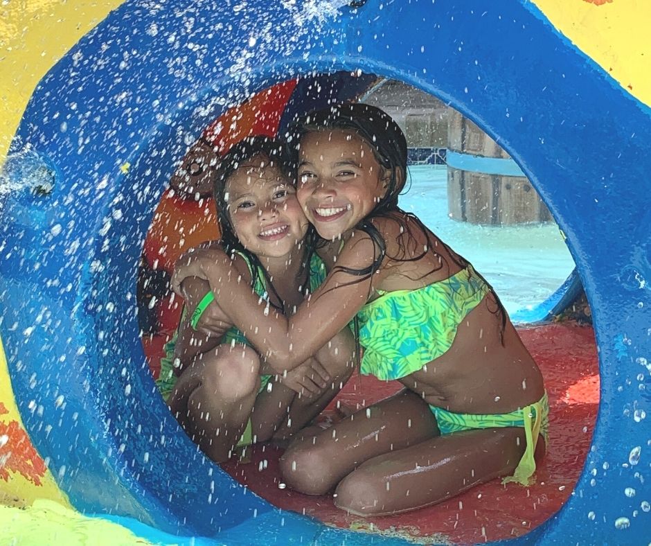 Two girls sitting in silly sub at waterpark