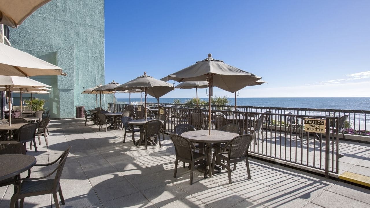 Oceanfront outdoor patio at Compass Cove