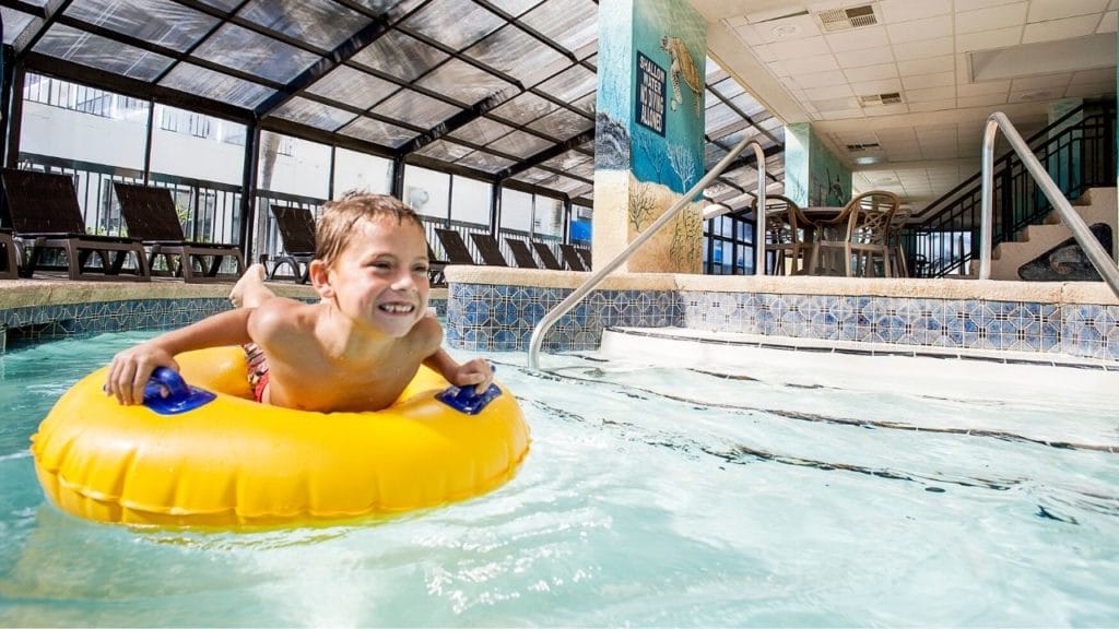 Boy on tube in indoor lazy river