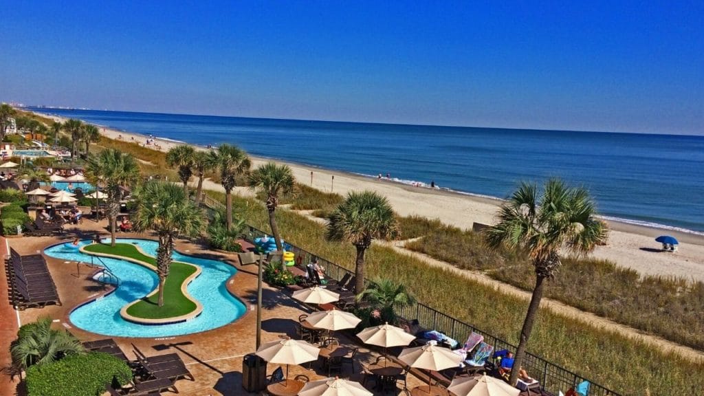 Drone of oceanfront pool deck at Compass Cove