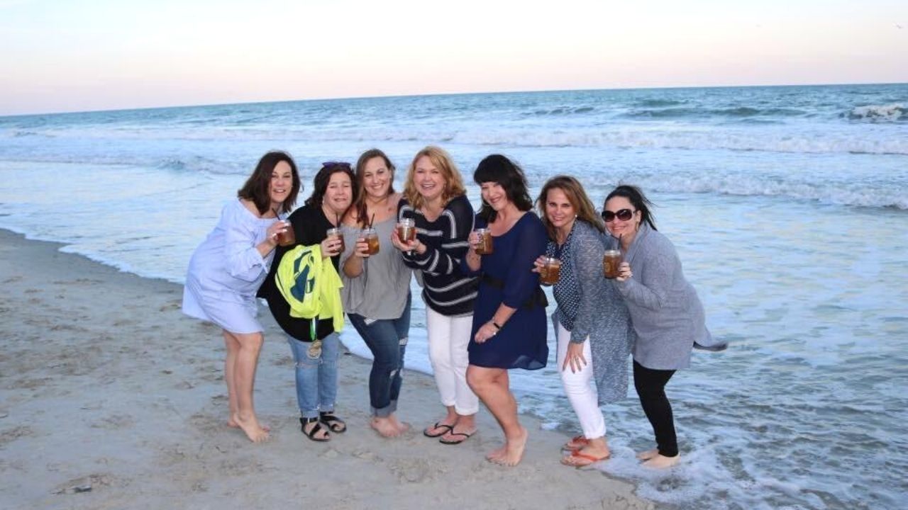 Group of Women on Beach with Cocktails