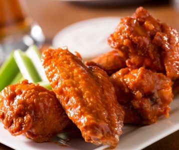 Bufallo Chicken Wings on a Plate with Beer and Celery