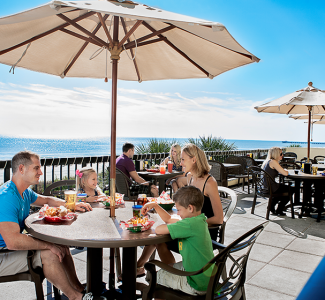 Family Eating on an Oceanfront Patio